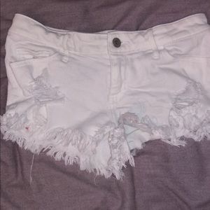 White ripped shorts